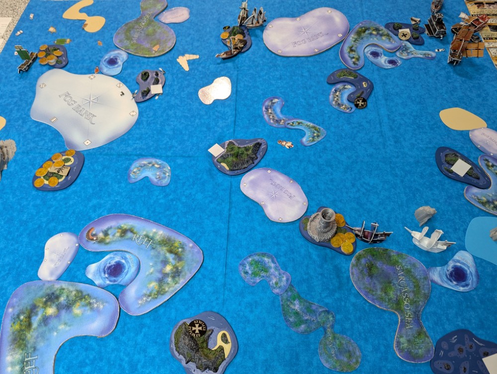 Indeed the Pirate plan went perfectly here at the very end, with La Louise receiving the coin from Edward England's Fancy, fleeing into the nearby fog bank, then dropping it at home for +2 gold (3 total) with Levasseur's bonus. The black ship (Nossa) also returned home safely, netting the Portuguese 4 gold from their mission to profit off the Ming silk trade.
